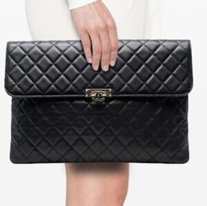 Authentic CHANEL Medium O-Case Clutch in black caviar leather with gold CC lock